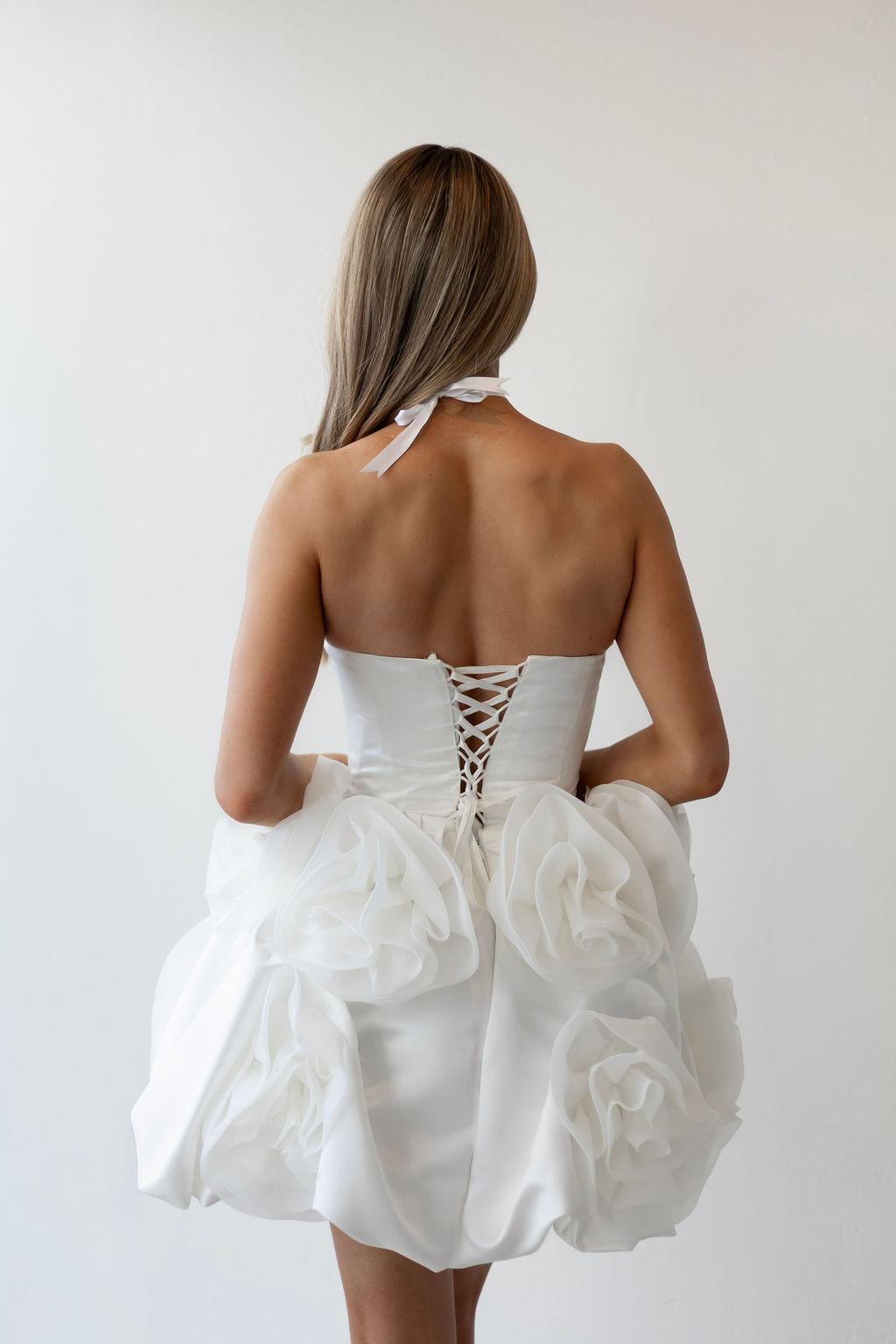 Back view of short white wedding dress
